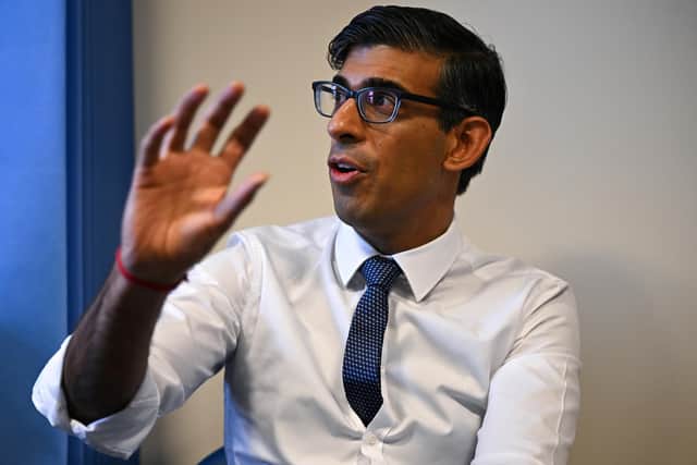 Prime Minister Rishi Sunak speaks during a meeting with a multi-disciplinary team who provide virtual care during a visit to the Rutland Lodge Healthcare Centre in Leeds.