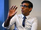 Prime Minister Rishi Sunak speaks during a meeting with a multi-disciplinary team who provide virtual care during a visit to the Rutland Lodge Healthcare Centre in Leeds.