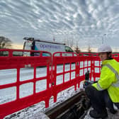 New recruits Lucy Kennedy (crouching) and Jodine Crombie (standing) at work on an Openreach fibre installation in Lanark.