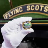 A collectable £2 coin at East Lancashire Railway in Bury ahead of its release by The Royal Mint, in collaboration with the National Railway Museum to celebrate the centenary of the world's most famous locomotive, the Flying Scotsman. Issue date: Tuesday February 21, 2023.