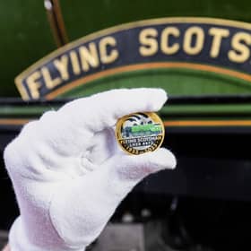 A collectable £2 coin at East Lancashire Railway in Bury ahead of its release by The Royal Mint, in collaboration with the National Railway Museum to celebrate the centenary of the world's most famous locomotive, the Flying Scotsman. Issue date: Tuesday February 21, 2023.