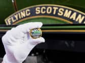 A collectable £2 coin at East Lancashire Railway in Bury ahead of its release by The Royal Mint, in collaboration with the National Railway Museum to celebrate the centenary of the world's most famous locomotive, the Flying Scotsman. Issue date: Tuesday February 21, 2023.
