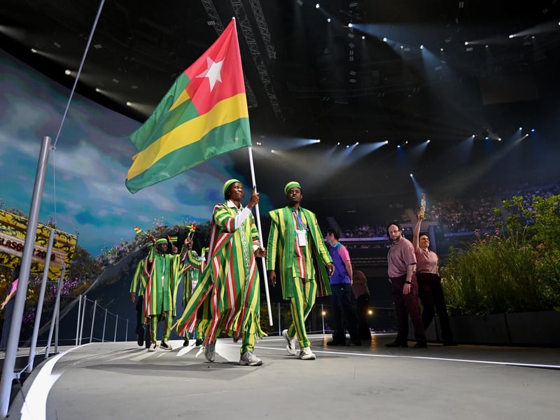 Flagbearer Fayza Issaka Abdoukerim of Team Togo and King's Baton Bearer Kossi Medard Nayo
