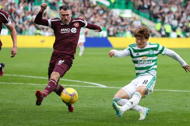 Kyogo Furuhashi gets in ahead of Hearts defender Michael Smith to smash home Celtic's third goal in their Premier Sports Cup victory over Hearts. (Photo by Craig Williamson / SNS Group)