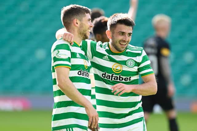 Greg Taylor (right) celebrate with Ryan Christie, with the pair top for Celtic assists this season. (Pic: Rob Casey/SNS group)