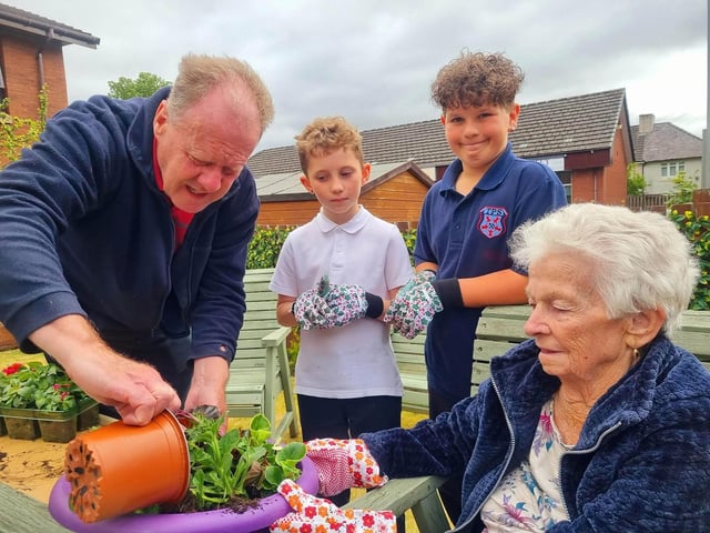 Residents at HC-One Scotland’s Highgate Care Home and children Tannockside Primary School gardening