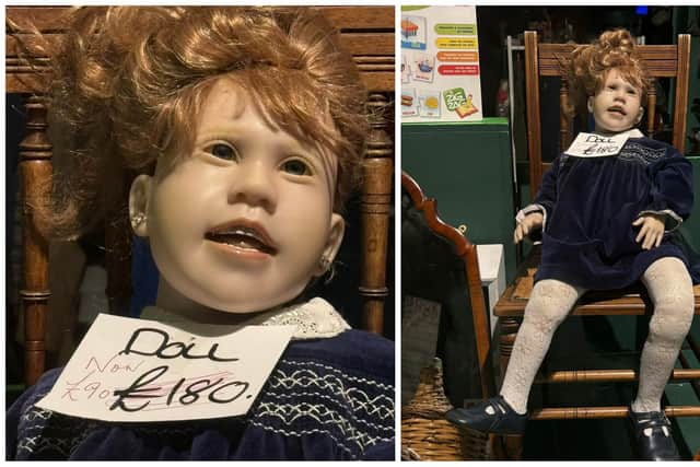 This 'creepy'-looking doll has been accused of scaring locals while sitting in an Edinburgh charity shop window. Pictures: Ms Marchmont/X