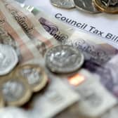 Money stacked on top of a council tax bill. PIC: Danny Lawson/PA Wire