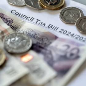 Money stacked on top of a council tax bill. PIC: Danny Lawson/PA Wire