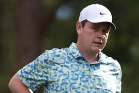 Bob MacIntyre pictured holding his back before being forced to withdraw during the third round of the BMW Championship in Colorado on Saturday. Picture: Harry How/Getty Images.