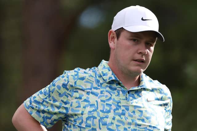 Bob MacIntyre pictured holding his back before being forced to withdraw during the third round of the BMW Championship in Colorado on Saturday. Picture: Harry How/Getty Images.
