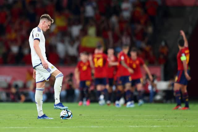 Scotland midfielder Scott McTominay looks dejected after Oihan Sancet put Spain 2-0 ahead. (Photo by Fran Santiago/Getty Images)