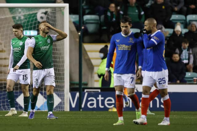 Hibs' Ryan Porteous is left dejected after his foul leads to a penalty against Rangers.