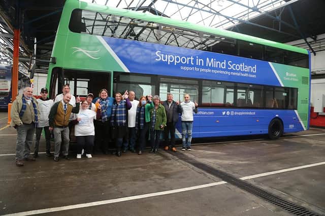 Support in Mind Scotland staff and people they support with the Lothian bus with Support in Mind Scotland livery