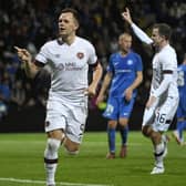 Hearts striker Lawrence Shankland celebrates scoring his penalty against RFS Pic: AP/Roman Koksarov