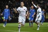 Hearts striker Lawrence Shankland celebrates scoring his penalty against RFS Pic: AP/Roman Koksarov