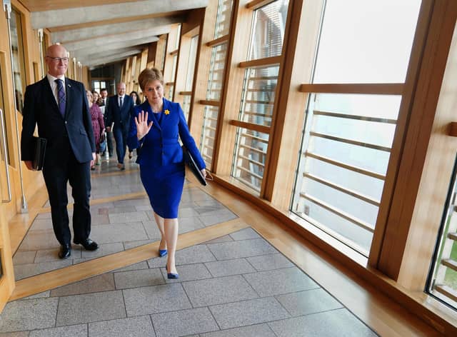 Outgoing First Minister Nicola Sturgeon arrive for her last First Minster's Questions (FMQs) in the debating chamber of the Scottish Parliament in Edinburgh