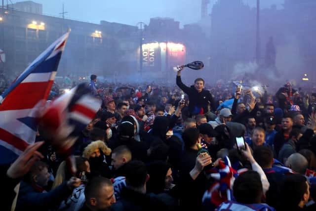 Rangers fans celebrate in George Square after Rangers win the Scottish Premiership title.