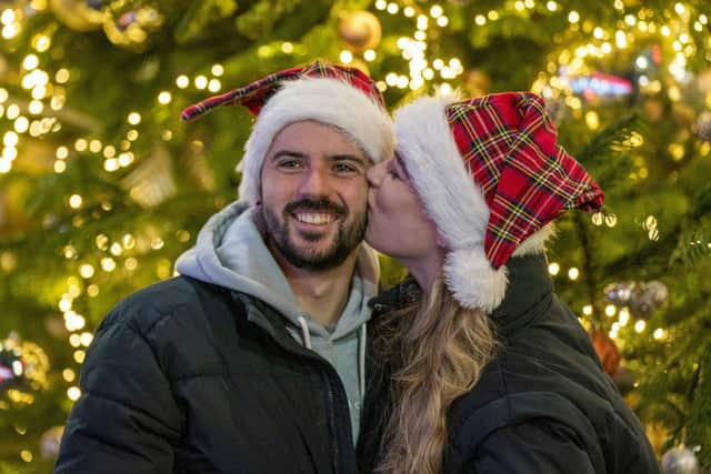 Brandon Fernandes with partner Tylo Verreynne, from Glasgow, during Edinburgh's Hogmanay celebrations. Picture: Jane Barlow/PA Wire