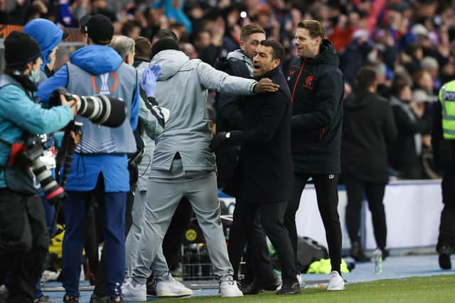 Rangers manager Giovanni van Bronckhorst celebrates at full time.