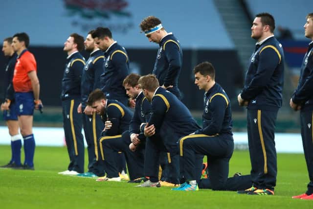 Scotland players were caught by surprise when members of the England team took a knee.
