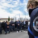 Prison officers gather and block the entrance of the jail during a protest in Beziers, south of France. French police are hunting for a group of gunmen who killed two prison officers and wounded three others, in an attack of a prison van transporting an inmate at a motorway toll in Incarville, northern France. Picture: Pascal Guyot/AFP via Getty Images