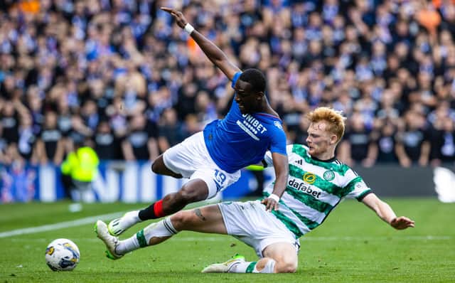 Celtic's Liam Scales tackles Rangers' Abdallah Sima during the previous meeting at Ibrox in September. (Photo by Alan Harvey / SNS Group)