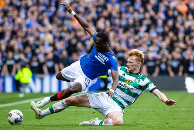 Celtic's Liam Scales tackles Rangers' Abdallah Sima during the previous meeting at Ibrox in September. (Photo by Alan Harvey / SNS Group)