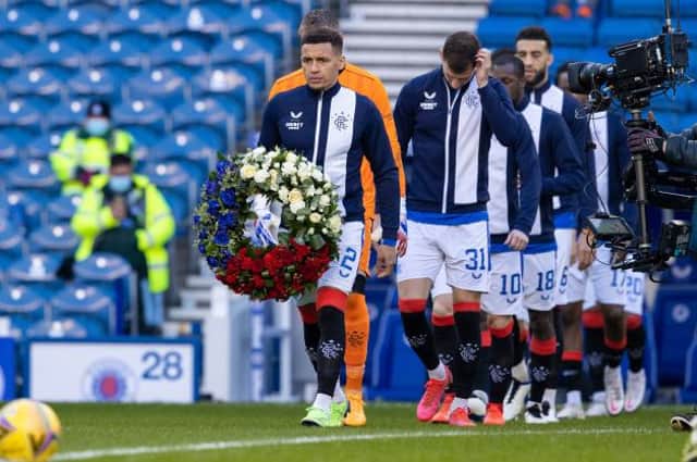 Rangers' James Tavernier carries a wreath as he leads the home team out on the 50th anniversary of the Ibrox Disaster  (Photo by Alan Harvey / SNS Group)