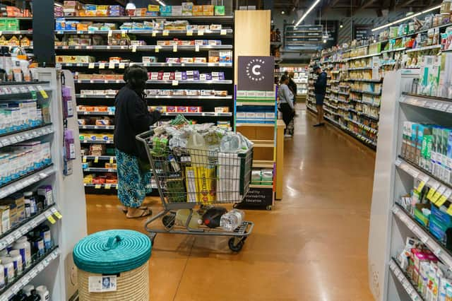 Shoppers are seen at a branch of Whole Foods Market , which has closed a branch in San Francisco amid crime fears.