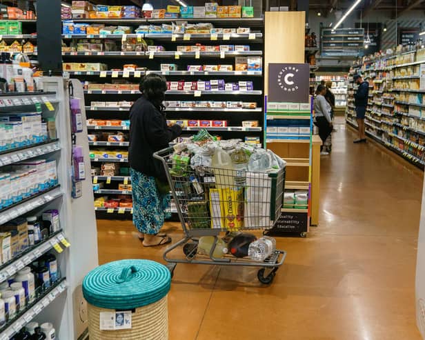 Shoppers are seen at a branch of Whole Foods Market , which has closed a branch in San Francisco amid crime fears.