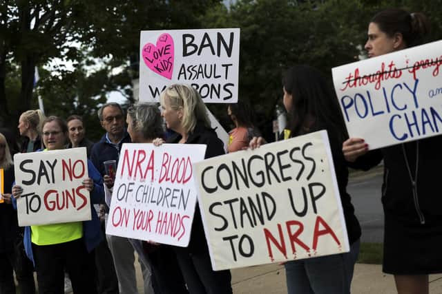 Gun-control campaigners hold a vigil outside the National Rifle Association headquarters in Fairfax, Virginia, following the mass shooting at Robb Elementary School, in Uvalde, Texas. (Picture: Kevin Dietsch/Getty Images)