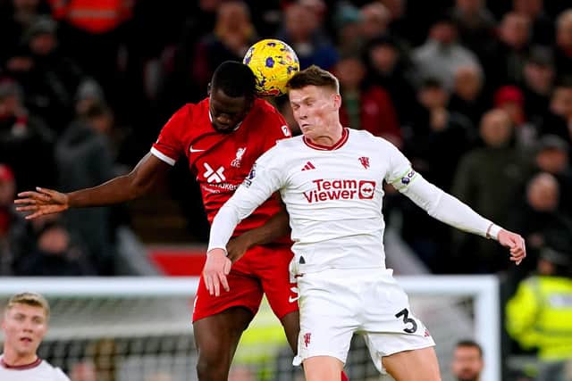 Liverpool's Ibrahima Konate and Manchester United's Scott McTominay battle for the ball.