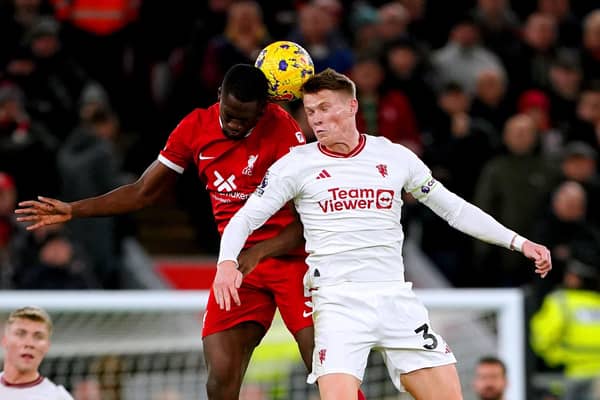 Liverpool's Ibrahima Konate and Manchester United's Scott McTominay battle for the ball.