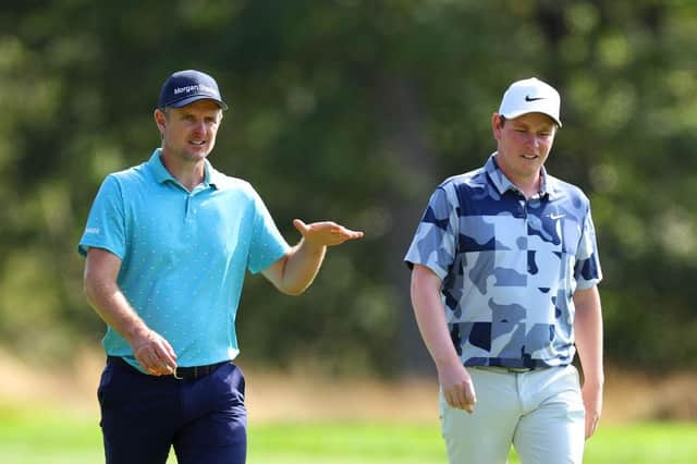 Bob MacIntyre, right, chats with Justin Roseduring the second round of the BMW PGA Championship at Wentworth Club in Virginia Water. Picture: Andrew Redington/Getty Images.