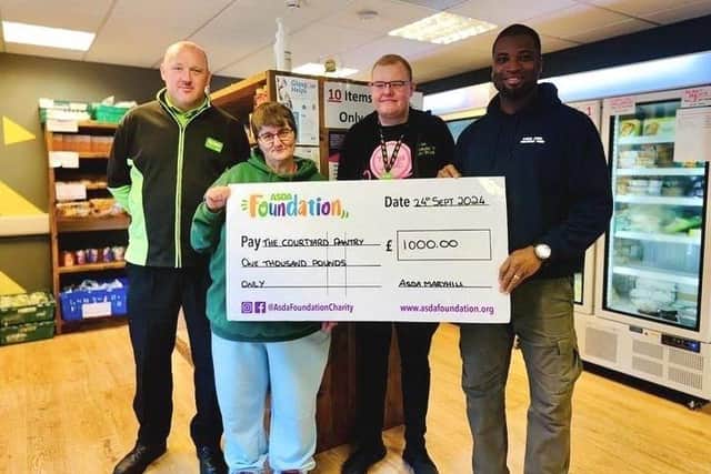 Asda Maryhill Community Champion presents Courtyard Pantry Enterprise with £1,000 grant cheque from the Asda Foundation
