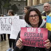 Demonstrators hold posters during an anti-war protest against the Russian invasion of Ukraine in Tbilisi, Georgia, on Sunday, May 8a day before Russia celebrates Victory Day, marking 77 years of the victory in the Second World War. (AP Photo/Shakh Aivazov)
