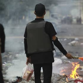Anti-coup demonstrators prepare to confront police during a protest in Tarmwe township, Yangon, Myanmar