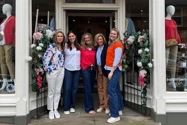 Sarah Thomson (L) at her store in Melrose, Scotland