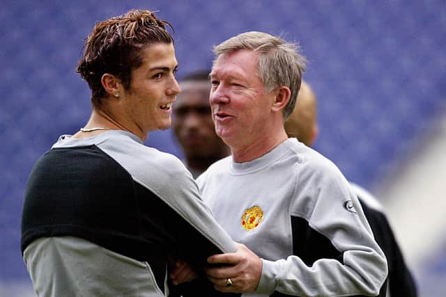 Cristiano Ronaldo with Sir Alex Ferguson in 2004 during his first spell at Manchester United. (Photo by NICOLAS ASFOURI/AFP via Getty Images)