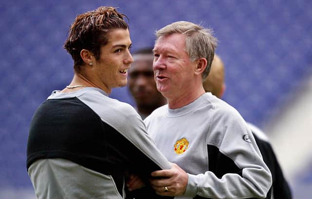Cristiano Ronaldo with Sir Alex Ferguson in 2004 during his first spell at Manchester United. (Photo by NICOLAS ASFOURI/AFP via Getty Images)
