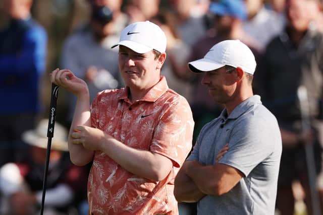 Bob MacIntyre chats with Rory McIlroy during the second round of the Genesis Scottish Open at The Renaissance Club in East Lothian. Picture: Harry How/Getty Images.