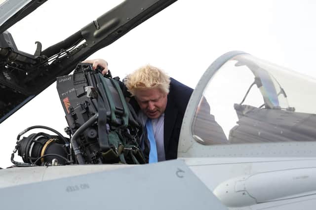 Boris Johnson visits an RAF base in Waddington yesterday. But the idea the UK has the military might to make a significant difference in any future conflict with Russia is a fantasy (Picture: Carl Recine/pool/AFP via Getty Images)
