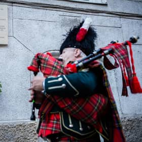 A piper plays during the unveiling of the Jane Haining memorials outside St Columba's Church of Scotland in Budapest. Photo: Barta Bálint/Church of Scotland/PA Wire