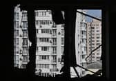 A broken window of a heavily damaged flat can be seen in the high-rise residential building hit by remains of a shot down Russian drone in Kyiv. Picture: Genya Savilov/AFP via Getty Images