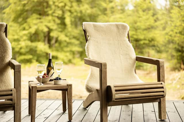 The cabins have decking with wooden chairs from which to enjoy views over Cally Loch. Pic: Alexander Baxter