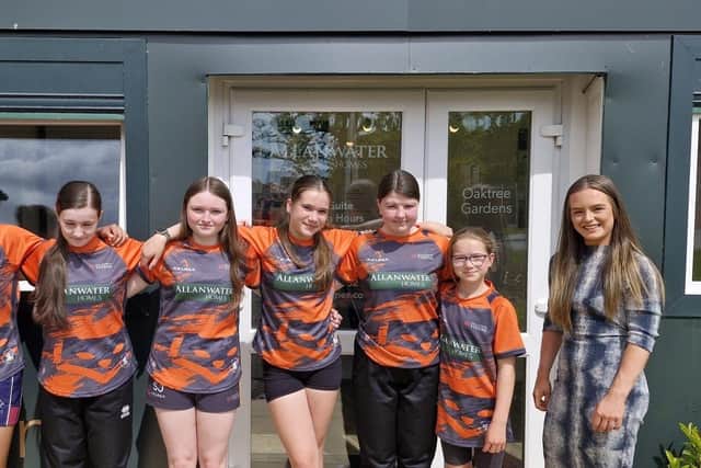The Hillfoot Vixens are pictured with Allanwater Homes Sales Manager, Lauren McNair.