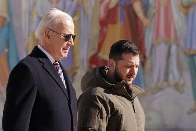 US president Joe Biden (left) walks next to Ukrainian president Volodymyr Zelensky (right) as he arrives for a visit in Kyiv on February. Picture: Dimitar Dilkoff/AFP via Getty Images