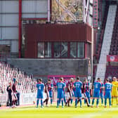 The Inverness players applaud Hearts on to the field at Tynecastle.