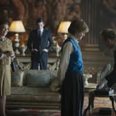 This image released by Netflix shows Olivia Colman, from left, Josh O'Connor and Emma Corrin in a scene from "The Crown." Season four premieres on Sunday, Nov. 15. (Des Willie/Netflix via AP)